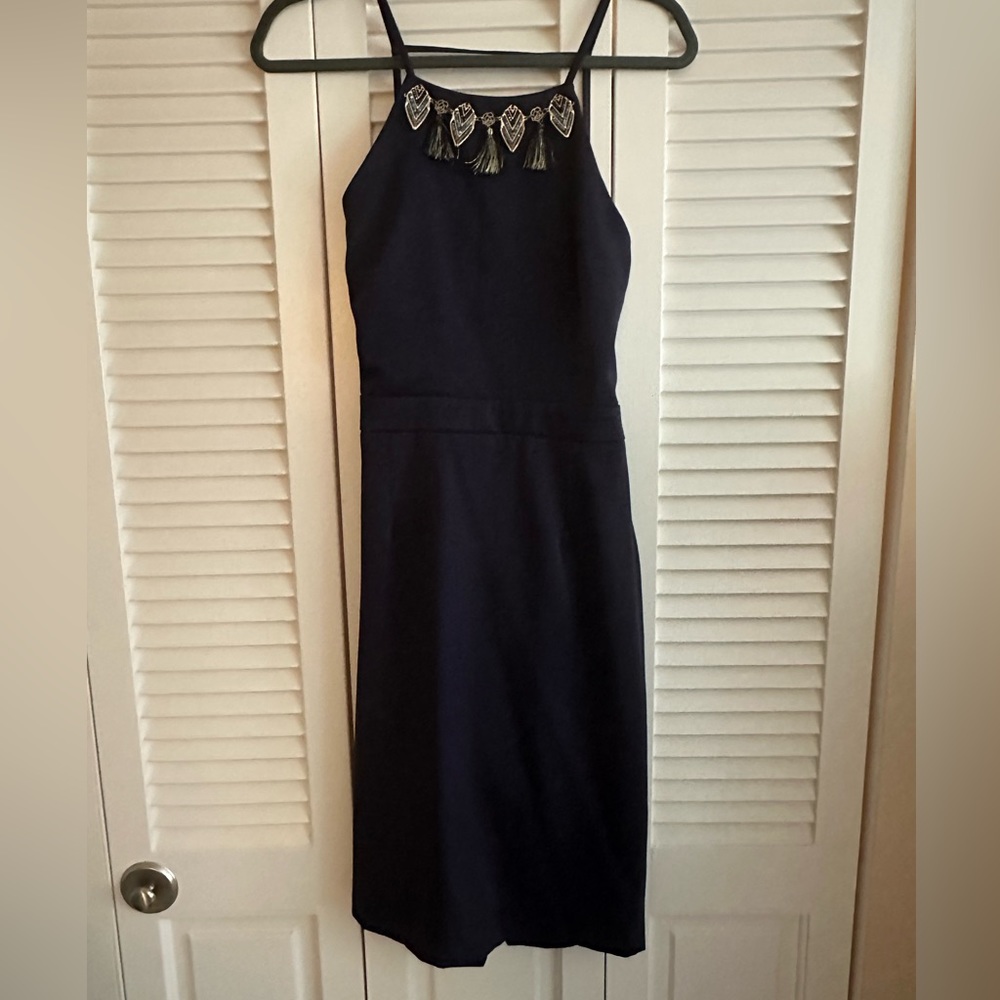 Gorgeous open back navy blue cocktail dress with fun detail
